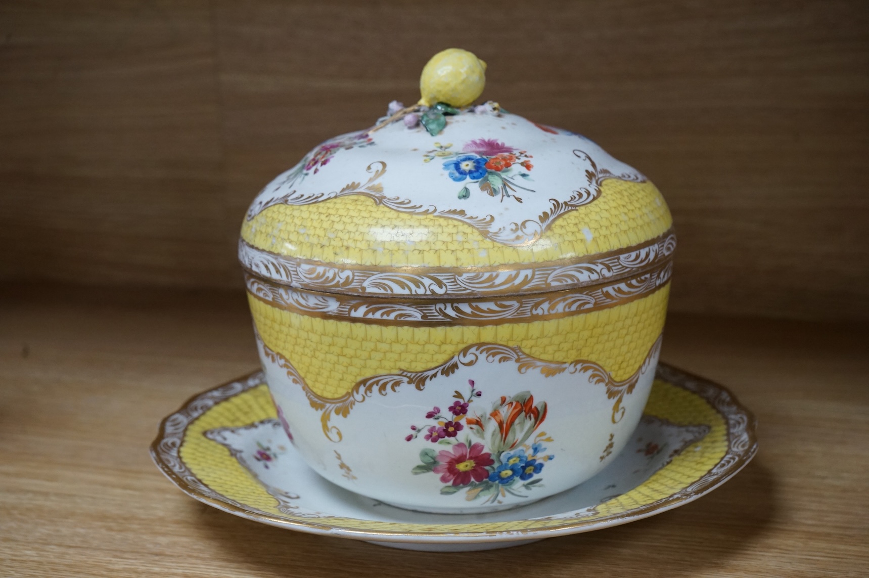 A late 18th century Vienna porcelain ecuelle, cover and stand, hand painted with flowers, 24cm in diameter